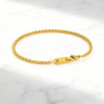 Pulseira para homem em aço dourado fina.